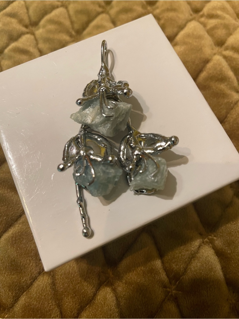 Sage green stone and silver pendant.